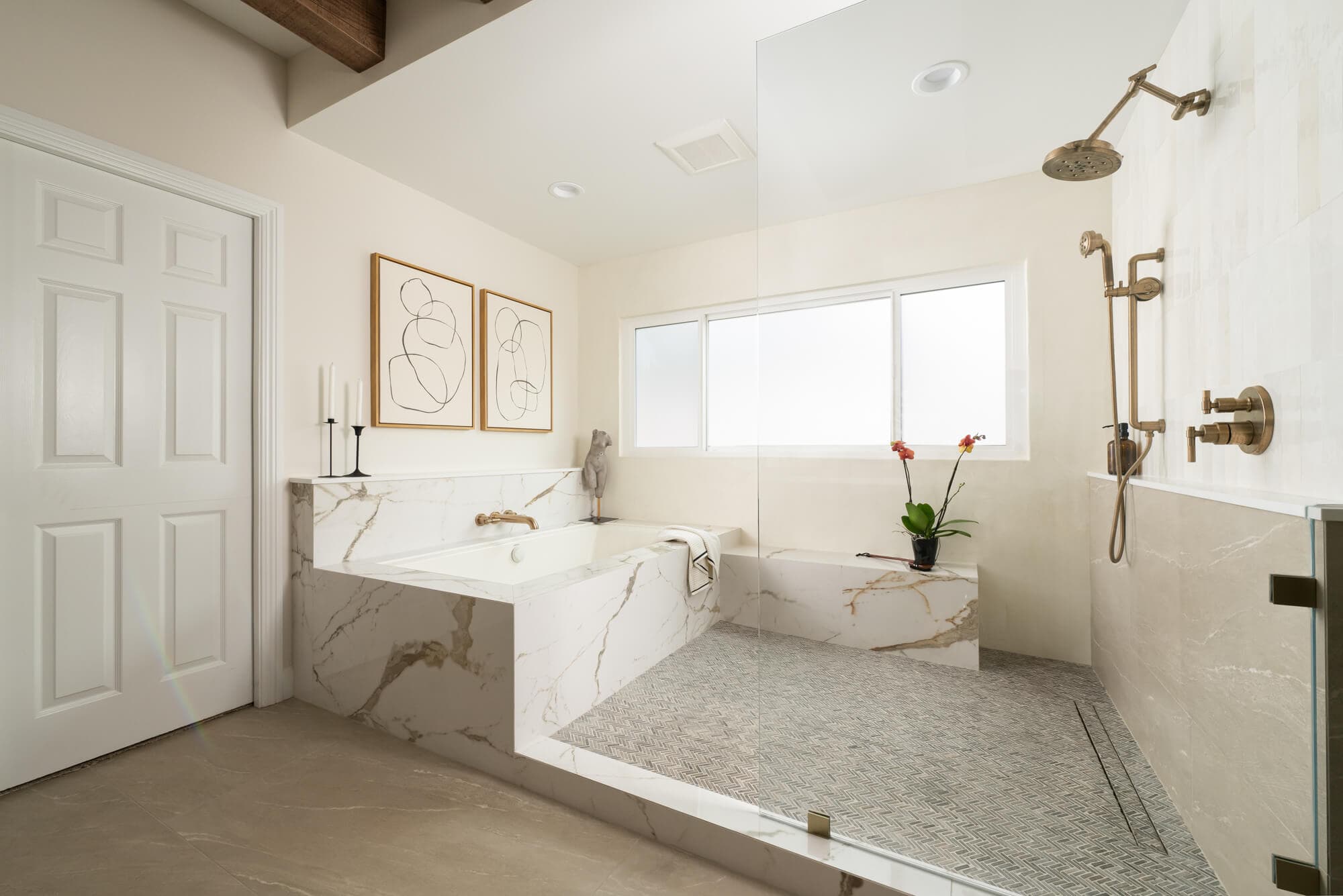 Dallas luxury bathroom remodel with bronze fixtures and open shower