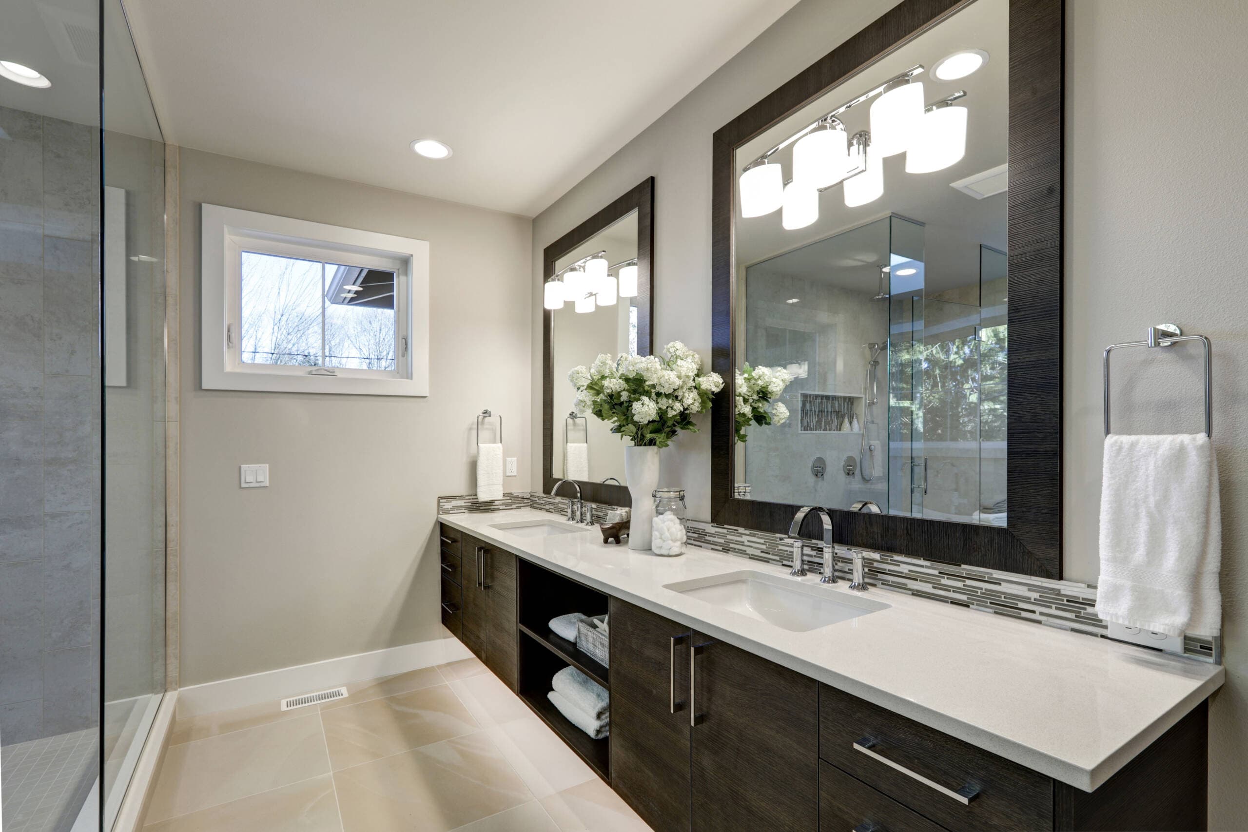 Floating double vanity with mirrors in a luxury Southlake bathroom remodel