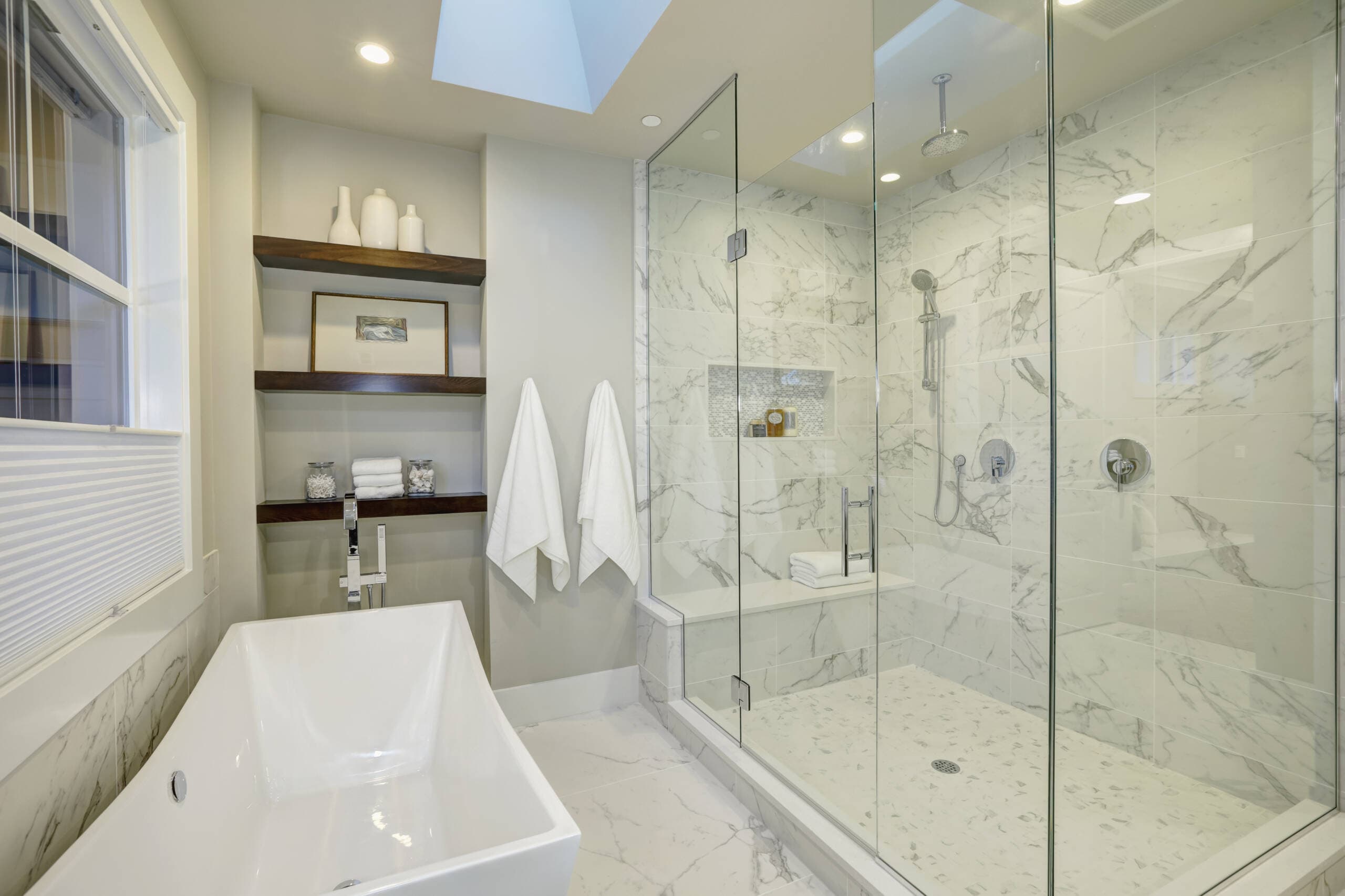 Serene marble bathroom retreat with frameless glass shower in Southlake, TX