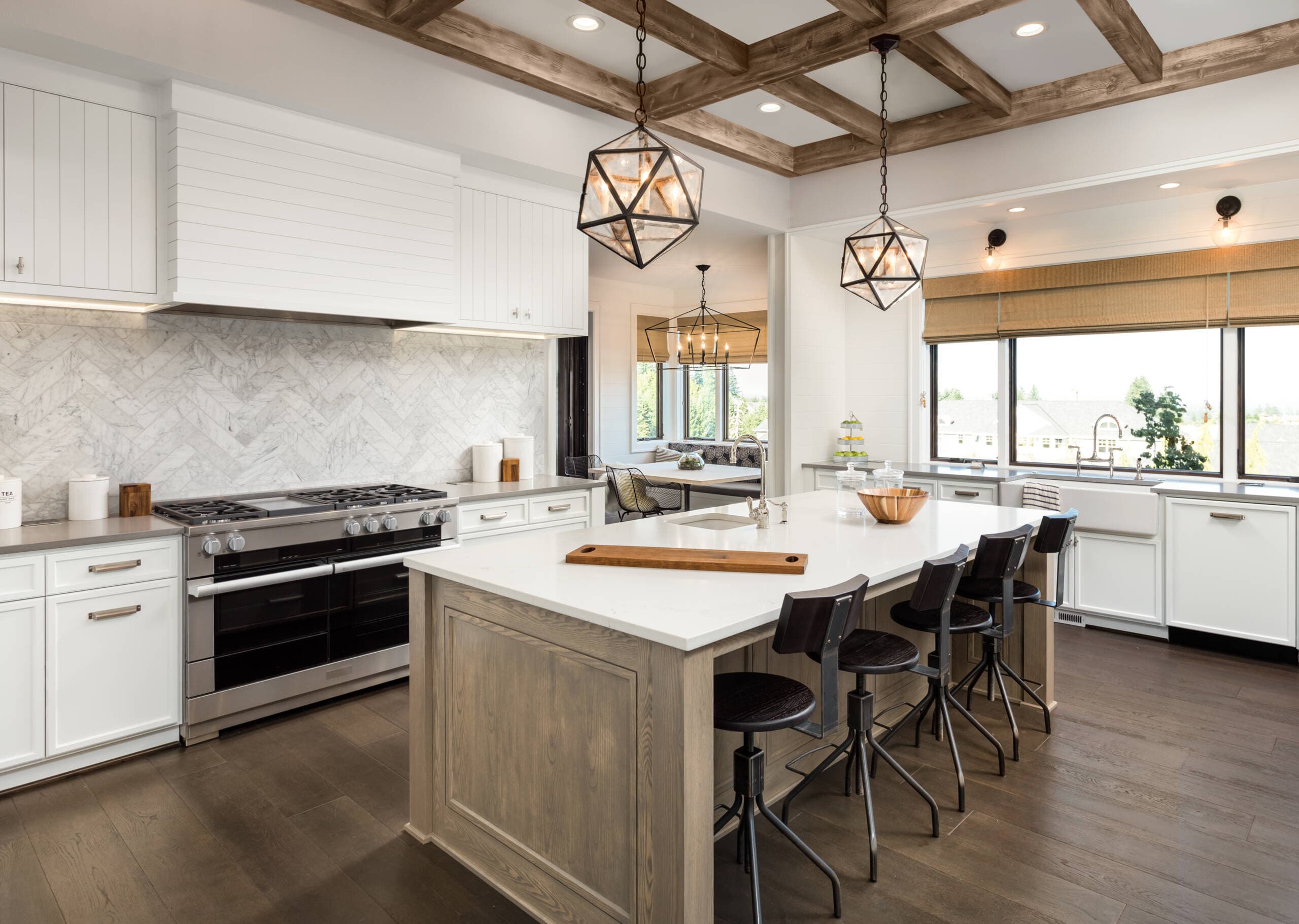 Modern warm two-tone kitchen design with white oak cabinetry