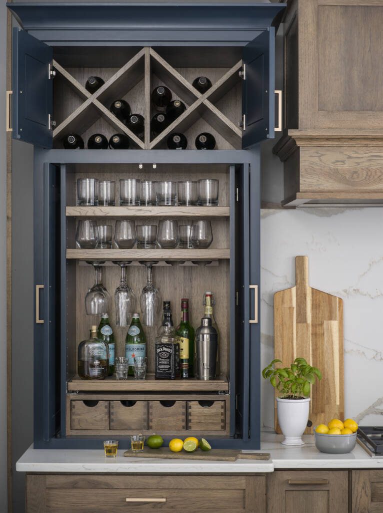Beautifully Functional Cabinetry -Southlake’s trusted luxury remodeling experts Hidden wine storage cabinet in Southlake custom kitchen