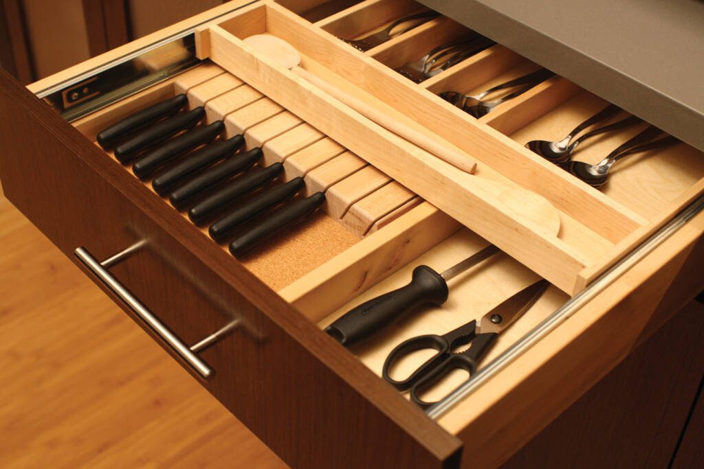 Beautifully Functional Cabinetry -Southlake’s trusted luxury remodeling experts Built-in knife block and utensil dividers in Southlake kitchen cabinets