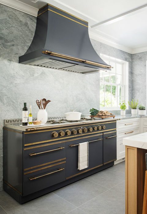 Range Hood Elegance -Southlake’s trusted luxury remodeling experts Two-Tone Custom Range Hood in White Oak and Brass Finish Southlake