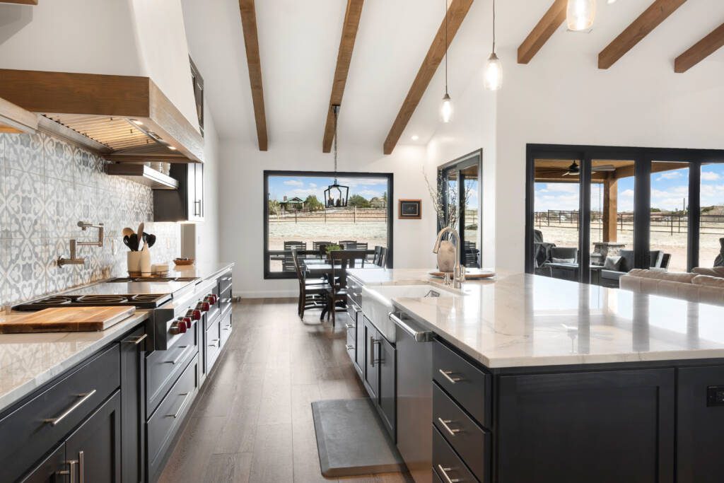 Timeless Charm with Modern Sophistication -Southlake’s trusted luxury remodeling experts Vaulted ceilings with exposed wood beams in modern Argyle kitchen remodel