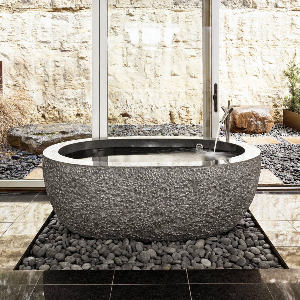 Freestanding Tubs -Southlake’s trusted luxury remodeling experts Luxury spa bath with pebble base and stone platform freestanding tub