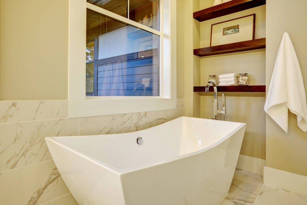 Freestanding Tubs -Southlake’s trusted luxury remodeling experts Contemporary bathroom with sculpted marble freestanding bathtub