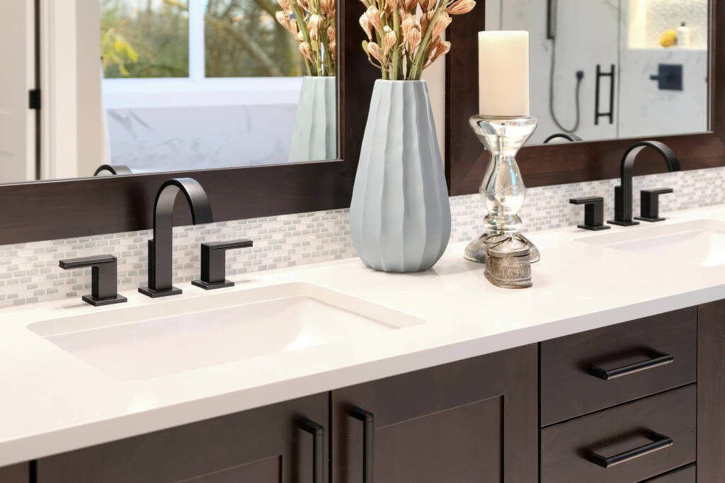 Matte black bathroom fixtures and designer mirror ensemble Southlake luxury remodel