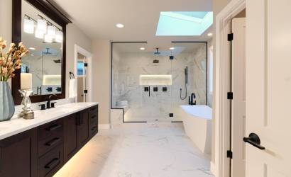 Modern spa bathroom Westlake – frameless glass shower and custom tile