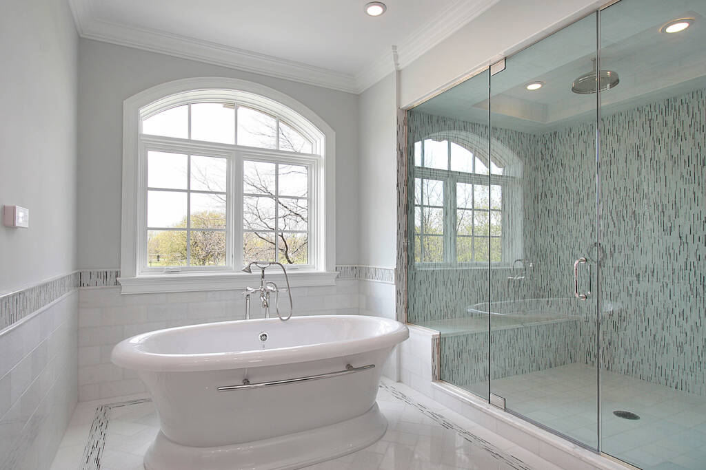 Freestanding Tubs -Southlake’s trusted luxury remodeling experts Freestanding tub centered under window in luxury Southlake remodel