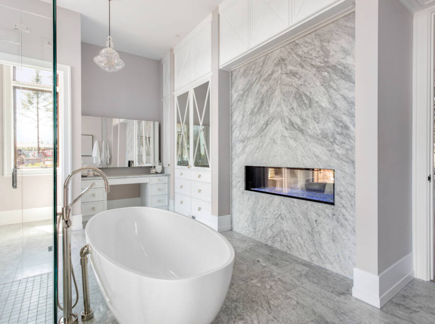 Elegant freestanding tub with marble flooring – Southlake luxury bathroom remodel