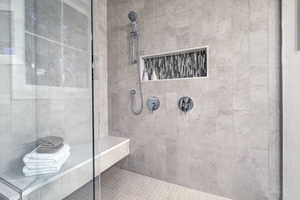 Showers -Southlake’s trusted luxury remodeling experts Curbless shower entry with marble slab walls and LED lighting